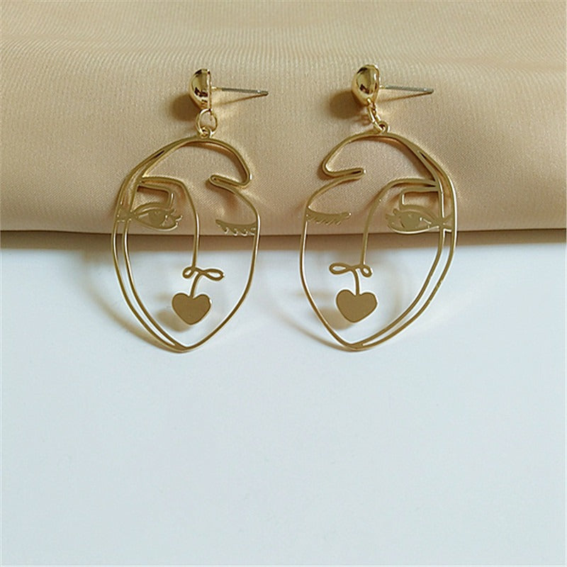 Pre Order:  Wink Face Hollow Earrings