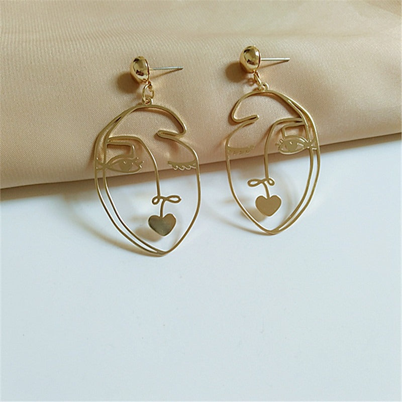 Pre Order:  Wink Face Hollow Earrings